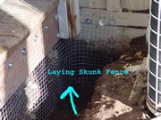Allstate Animal Control skunk fence being installed around a porch